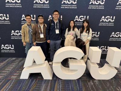 Group photo in front of the AGU sign