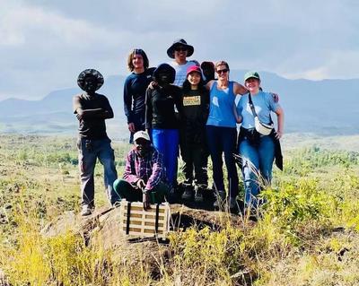 Group photo at the top of a mountain that is also the communal forest for the local village.